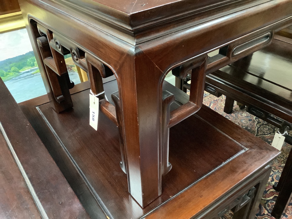 A 20th century Chinese rectangular hardwood low coffee table and a pair of similar lamp tables, largest width 106cm depth 51cm height 40cm